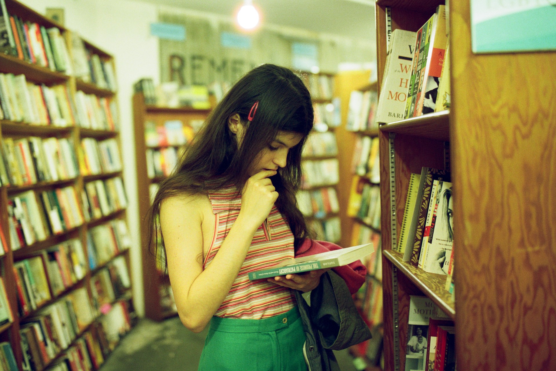 woman looking at a book
