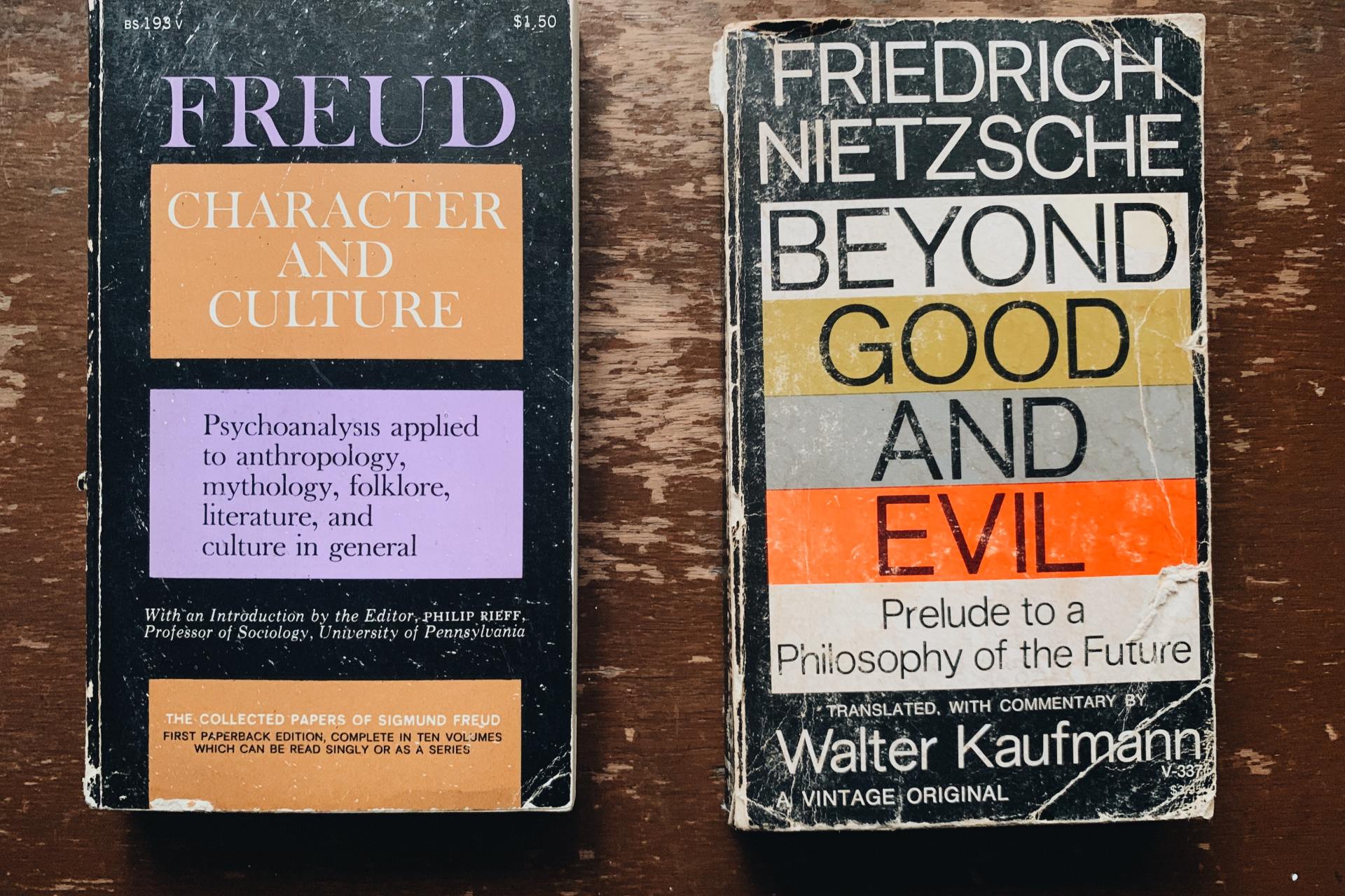 Two novel books on wooden surface