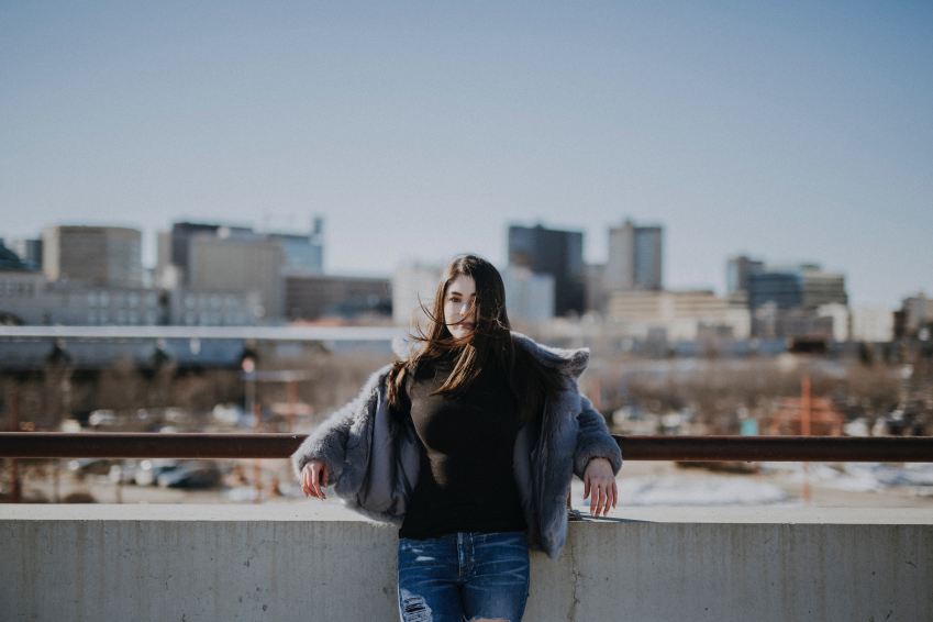 woman leaning on rail