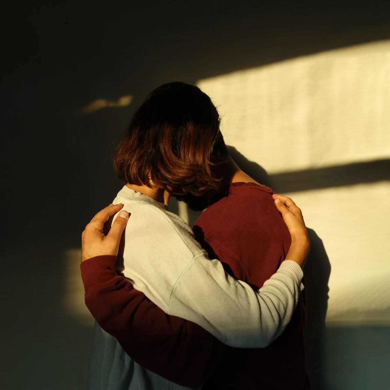 man and woman hugging each other