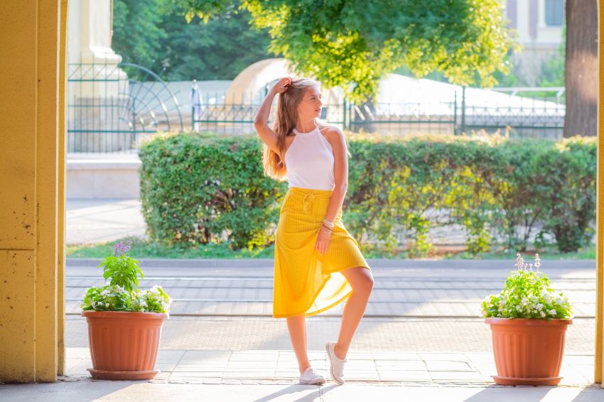 woman posing near plants