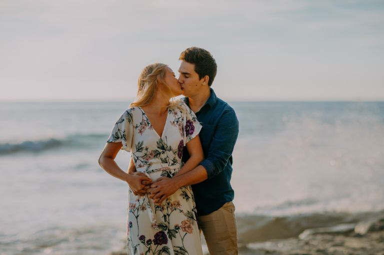 selective focus photography of couple on shoreline