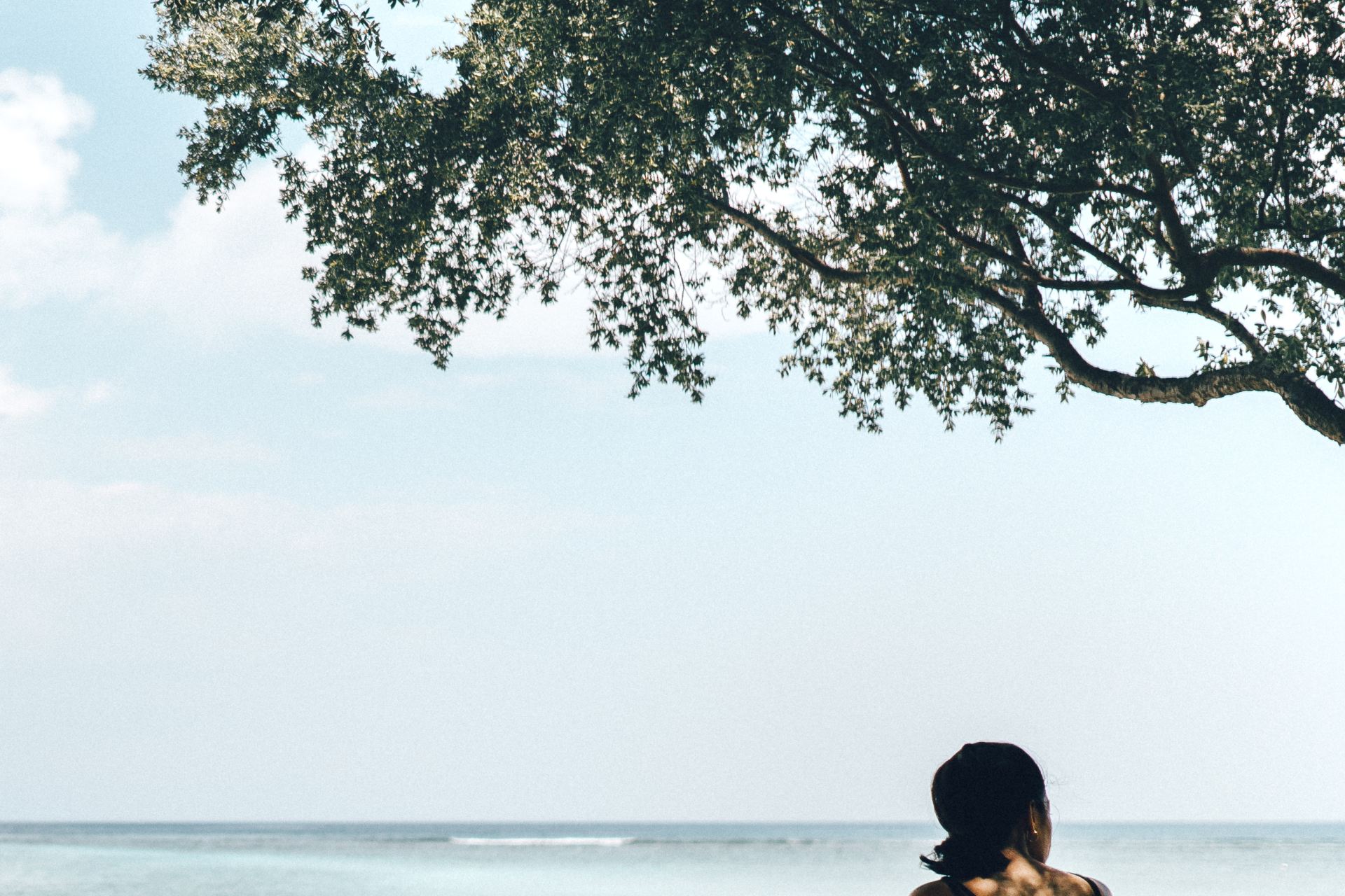 woman beside tree