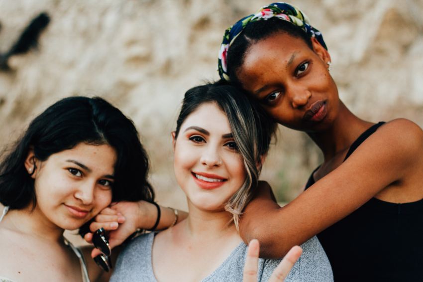 three women posting for picture