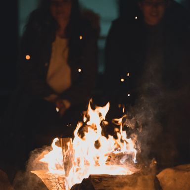 two person infront bondfire