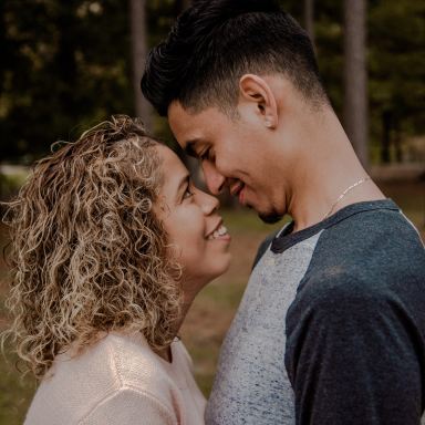 couple standing face to face closely to each other