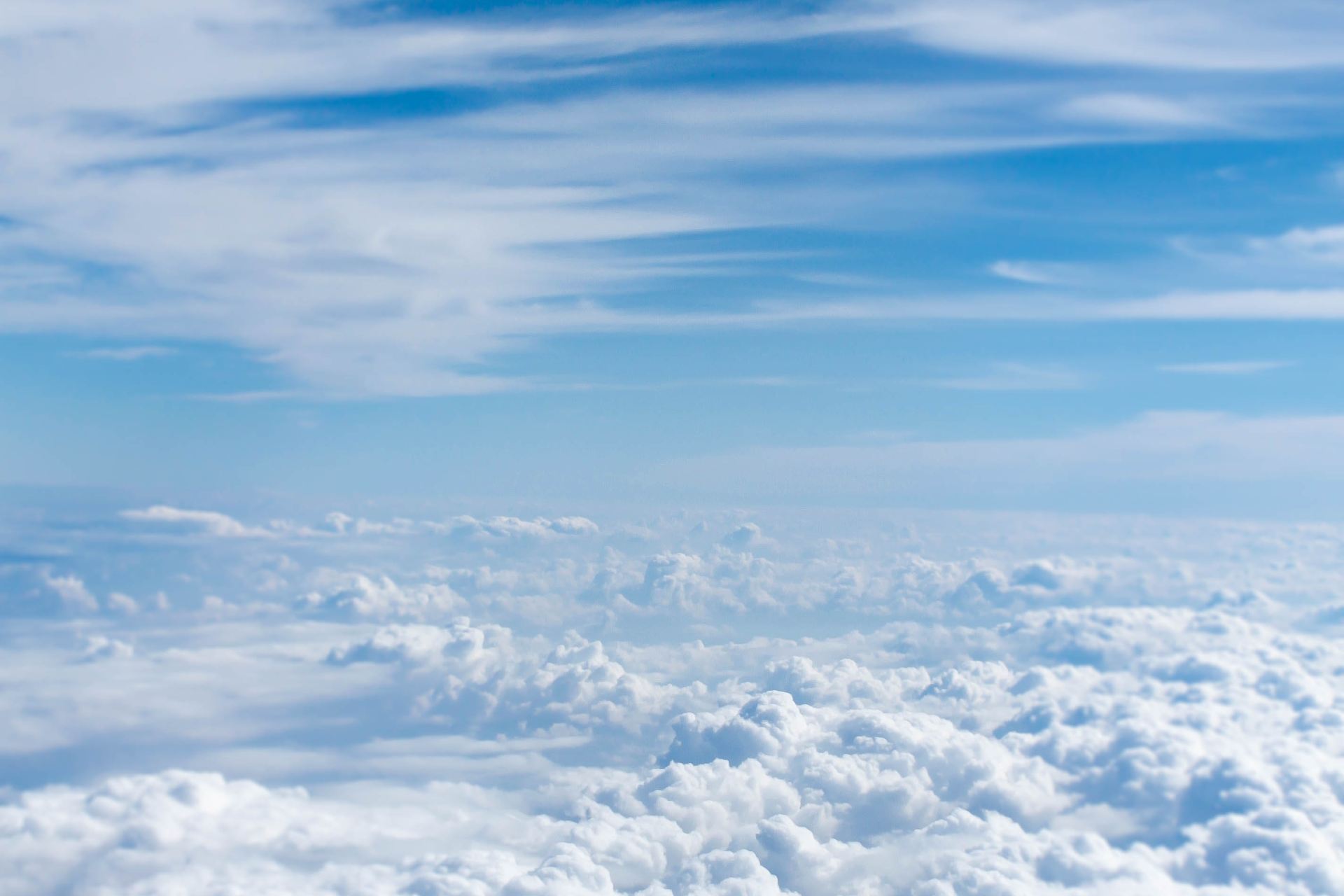 above-cloud photo of blue skies