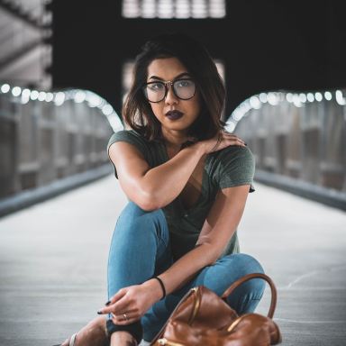 woman sitting on boat dock