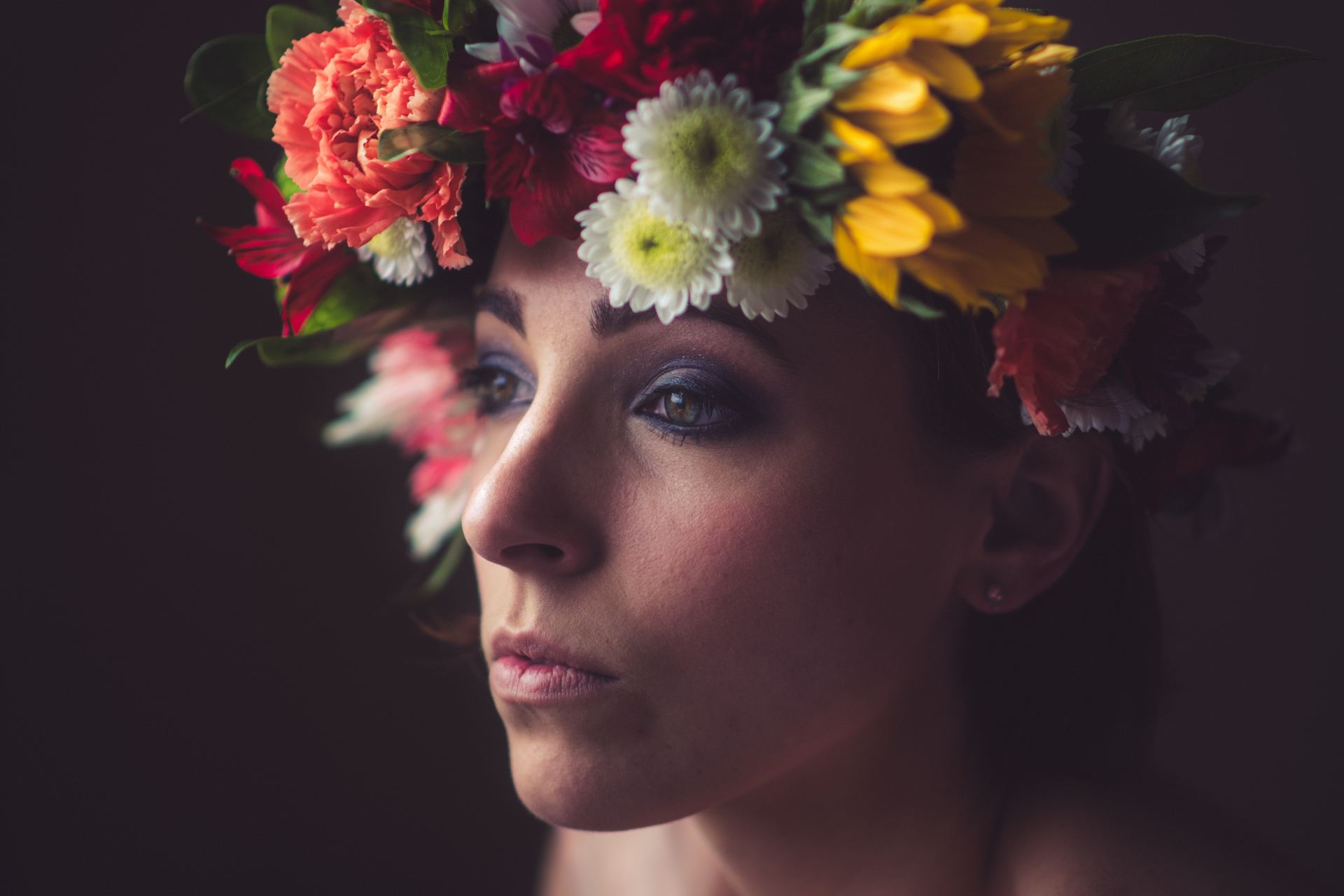 woman with yellow and red flower on her head