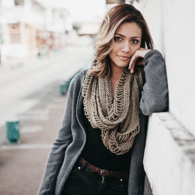 women's brown scarf and gray jacket