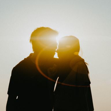 silhouette of man and woman about to kiss