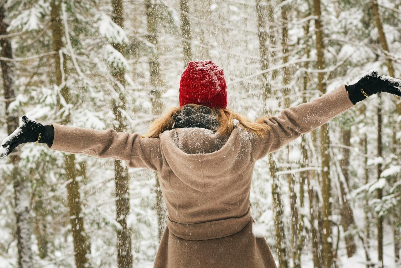 woman wearing brown coat