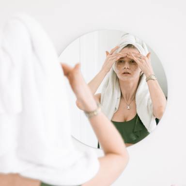 Photo Of Woman Massaging Her Face