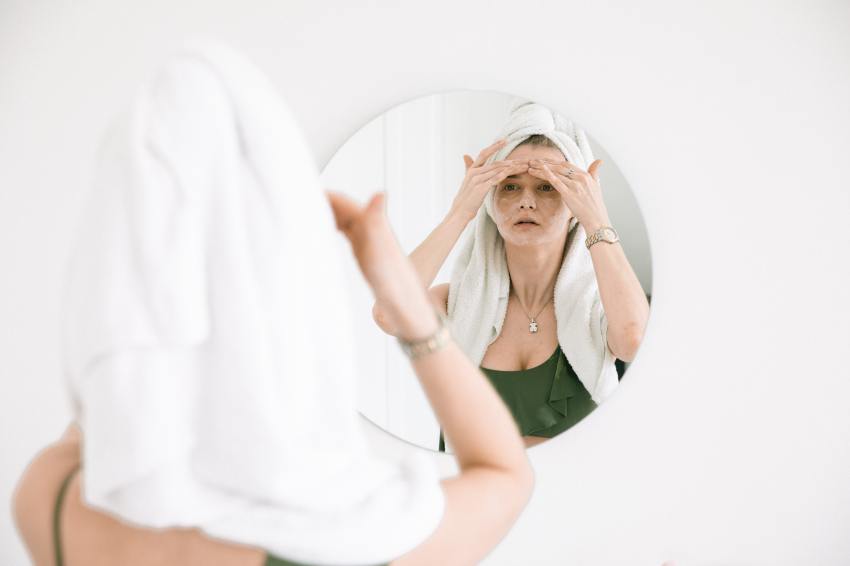 Photo Of Woman Massaging Her Face