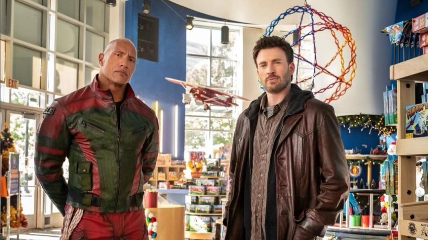 Chris Evans and Dwayne Johnson Are Giving Us The Holiday Heartthrob Movie We Deserve